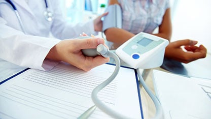 Closeup of Doctor Measuring Pressure on Tonometer