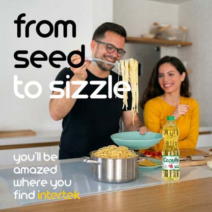 A man transferring cooked pasta into a bowl next to a woman in a kitchen